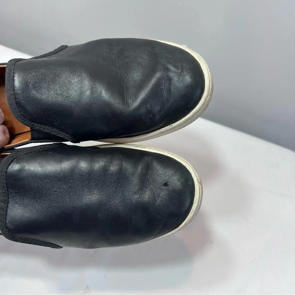 UGG Cas Slip-On Sneakers, which feature a black leather upper metallic heel 9